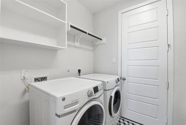 a utility room with dryer and washer