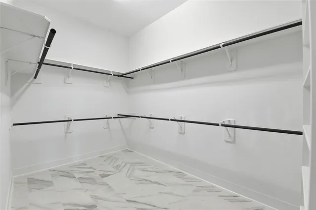 a view of an empty walk in closet