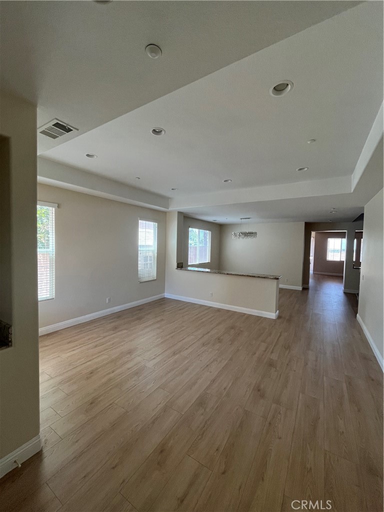 18388 Hidden Ranch Road Riverside, CA 92508 - Photo 8 of 46 a view of empty room with wooden floor and fan