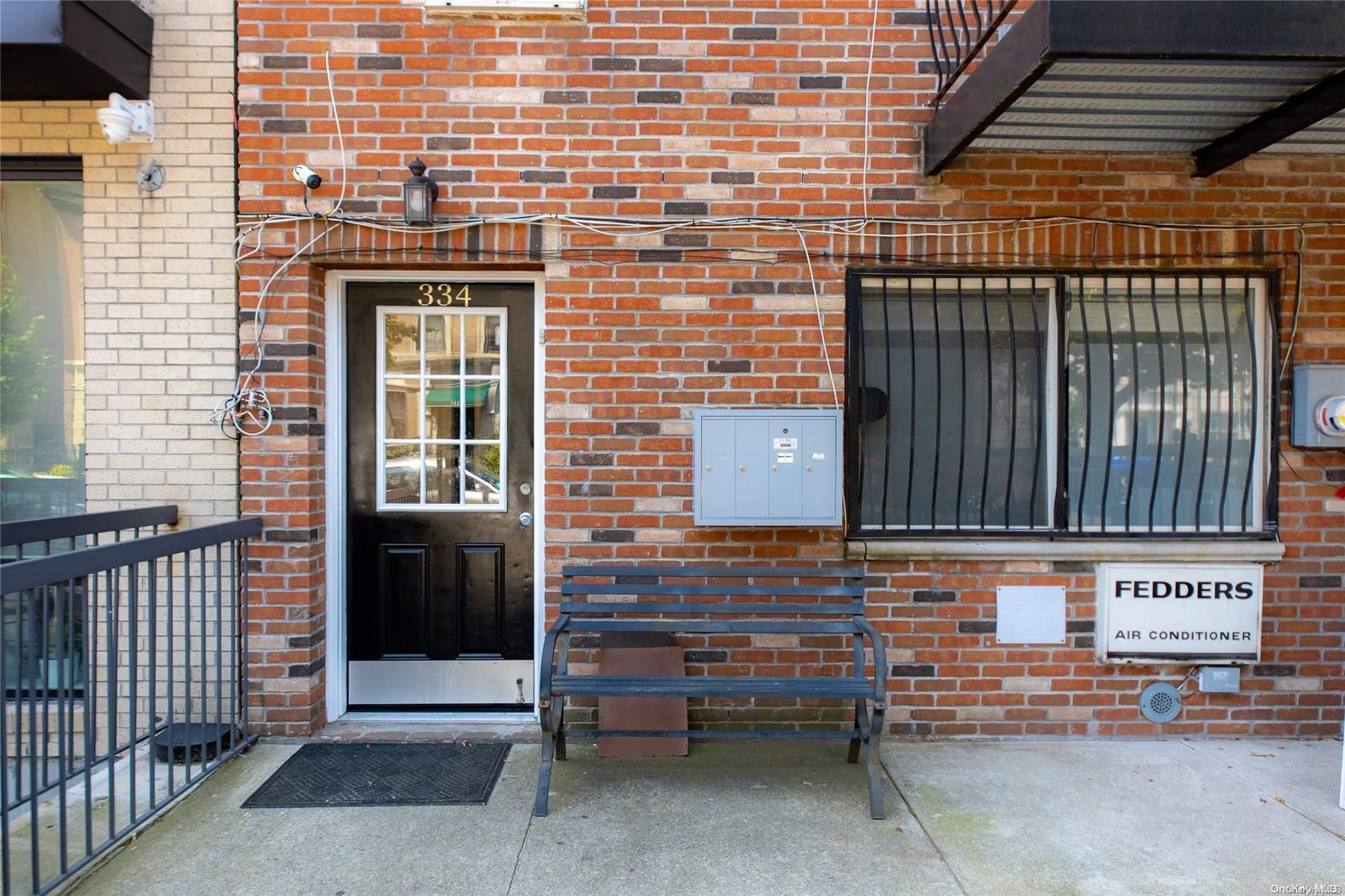 334 Lincoln Road Brooklyn, NY 11225 - Photo 11 of 11 a view of brick house with a door