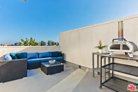 a view of a terrace with chairs