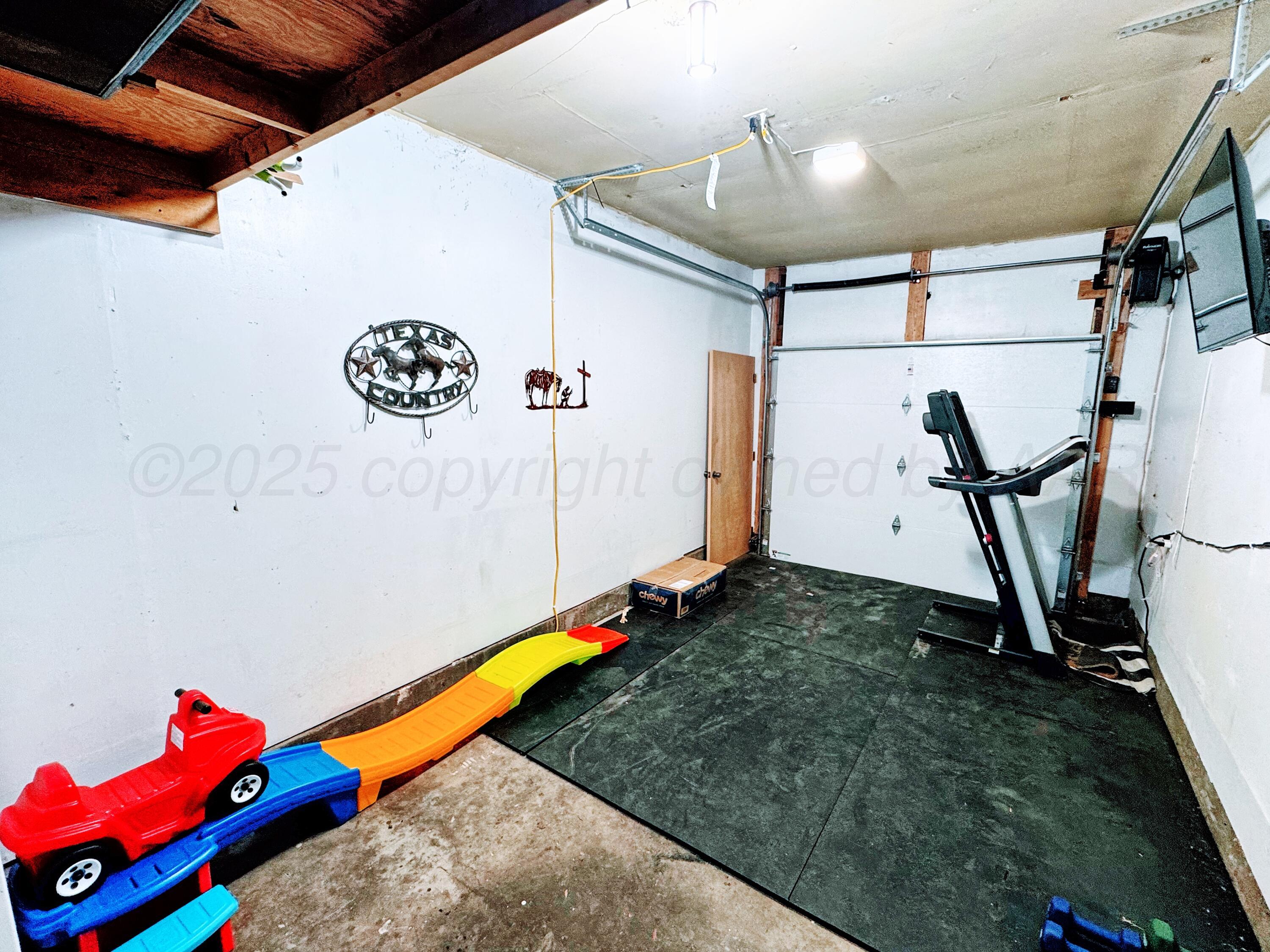 2006 Drake Drive Perryton, TX 79070 - Photo 14 of 17 a room with gym equipment and wooden floor