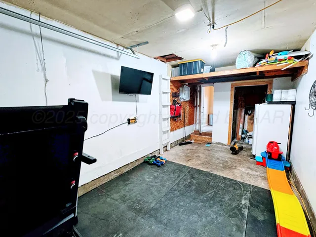 a storage utility room with two washing machine