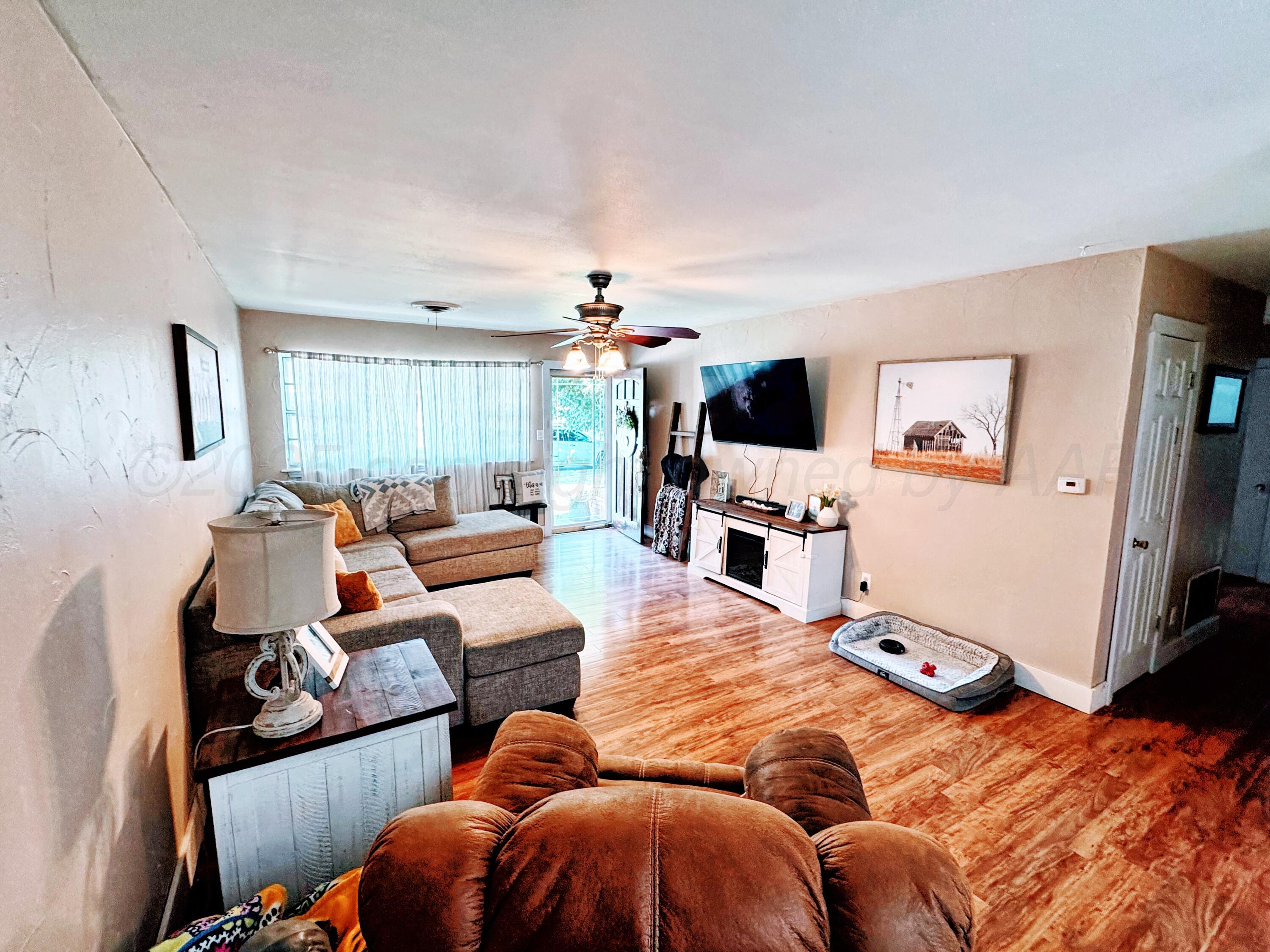 2006 Drake Drive Perryton, TX 79070 - Photo 7 of 17 a living room with furniture and a flat screen tv