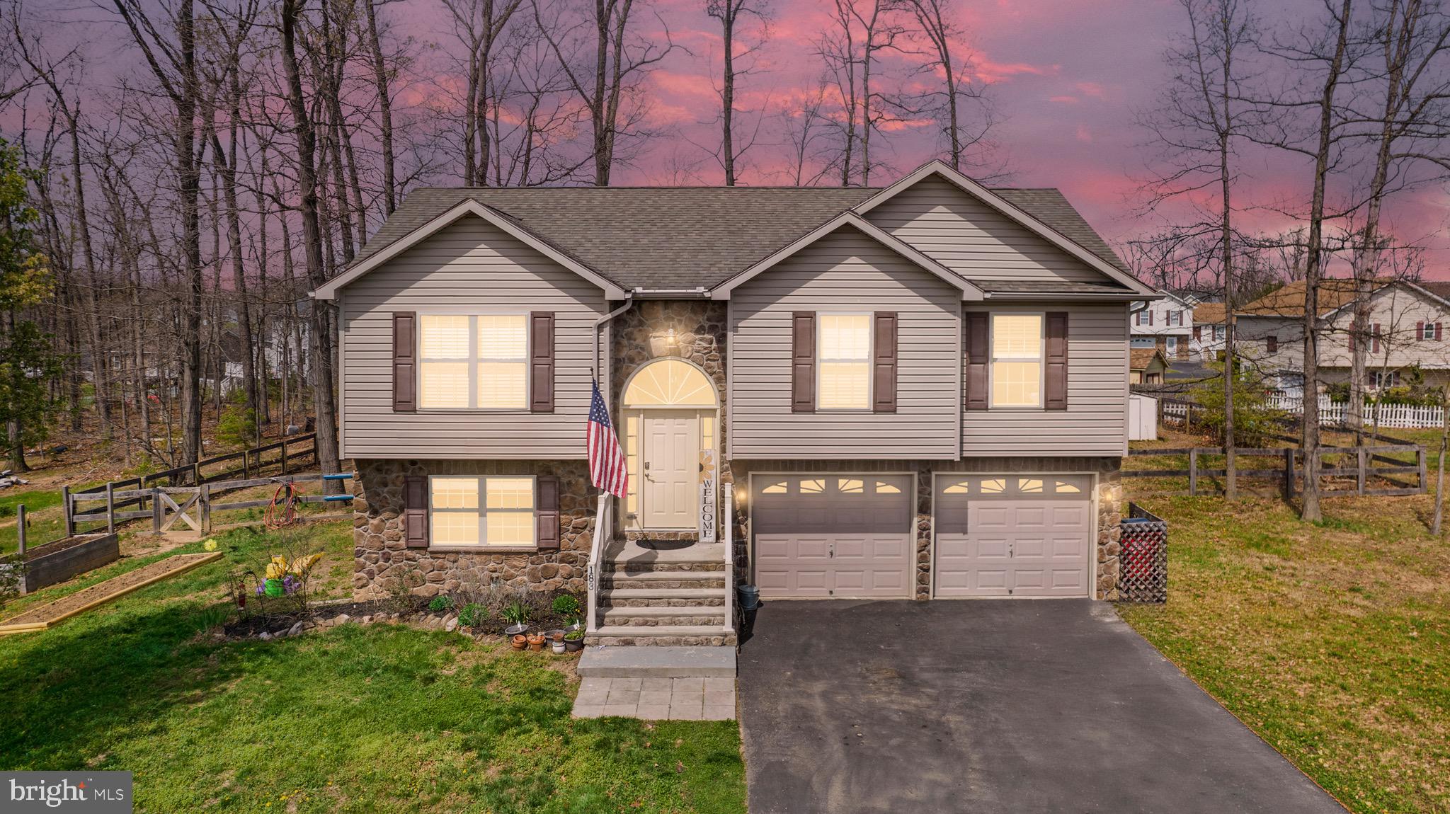 183 Basin Drive Inwood, WV 25428 - Photo 1 of 27 a front view of a house with a yard