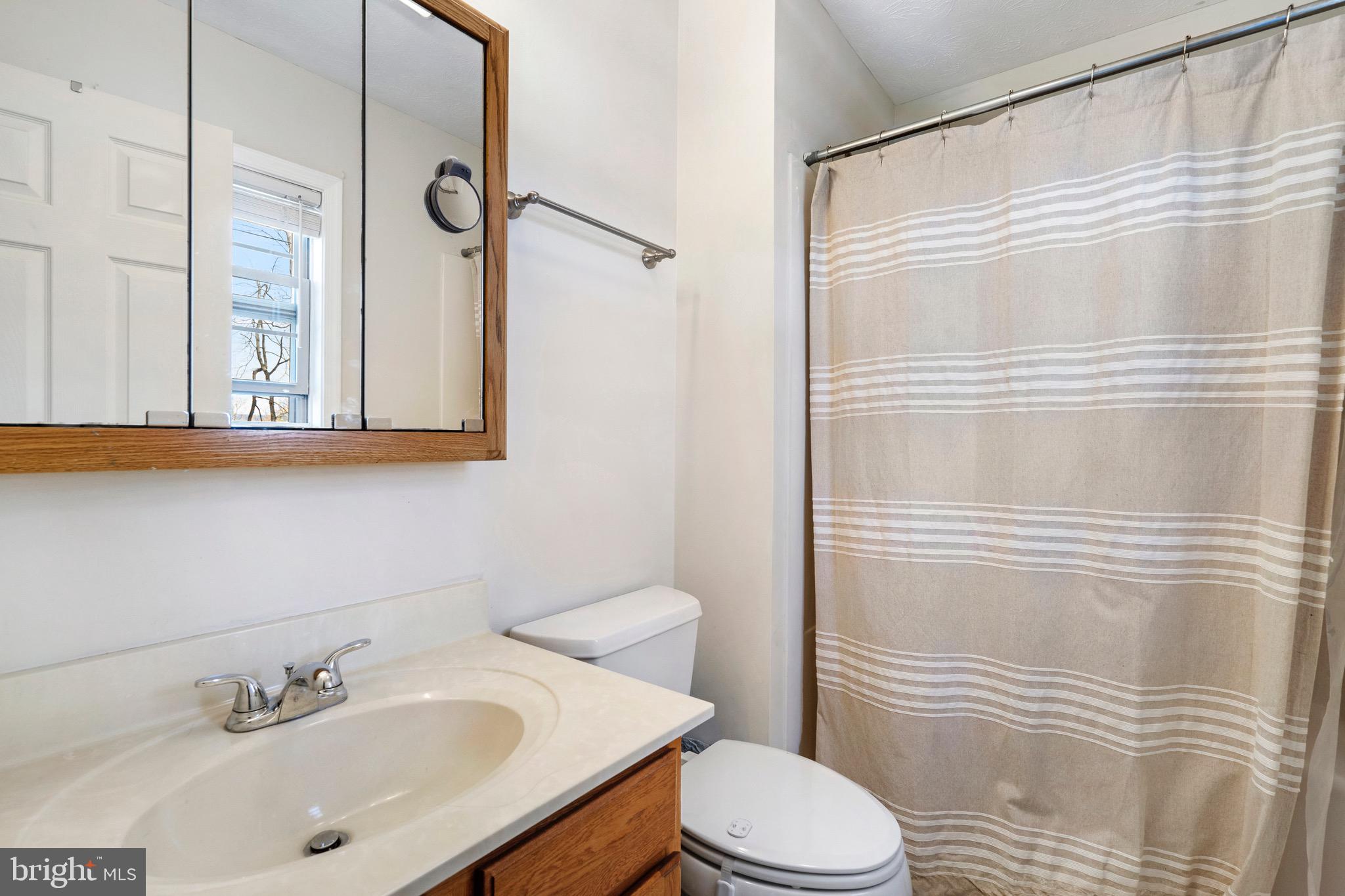 183 Basin Drive Inwood, WV 25428 - Photo 18 of 27 a bathroom with a sink toilet and shower