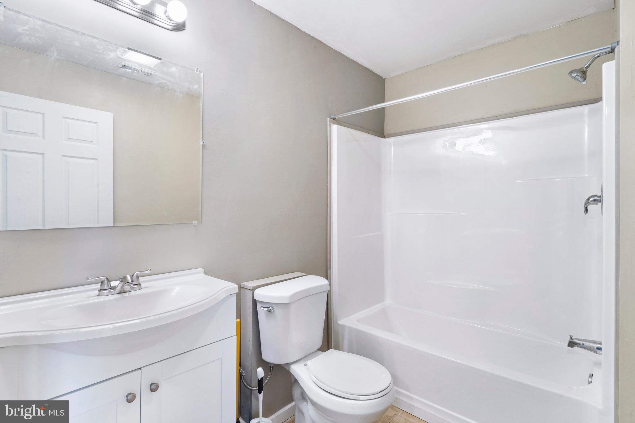 183 Basin Drive Inwood, WV 25428 - Photo 21 of 27 a bathroom with a sink toilet and shower
