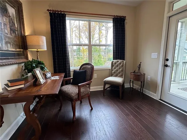 a view of a livingroom with furniture and a window