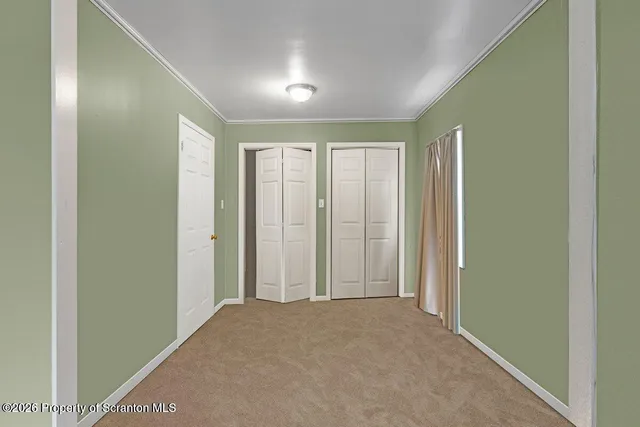 a view of hallway with livingroom