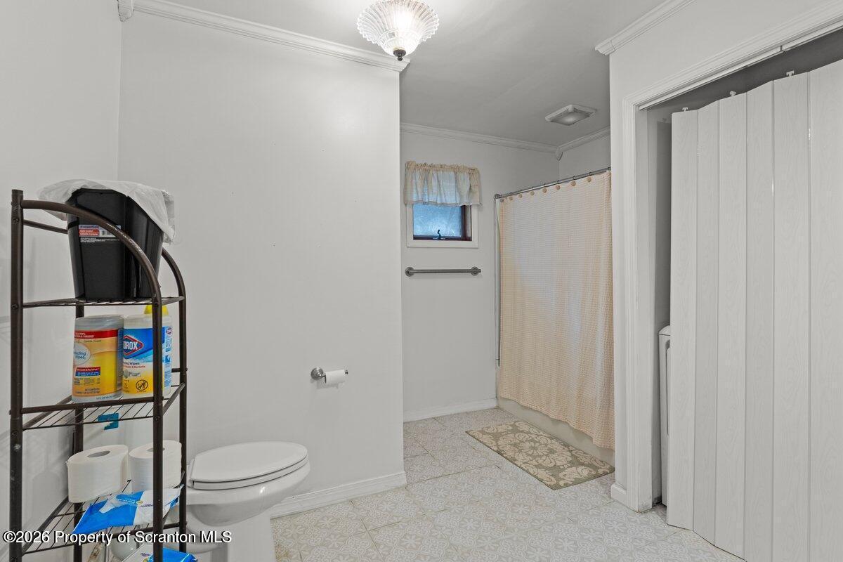 1411 Watson Street Scranton, PA 18504 - Photo 20 of 26 a bathroom with a toilet sink and shower