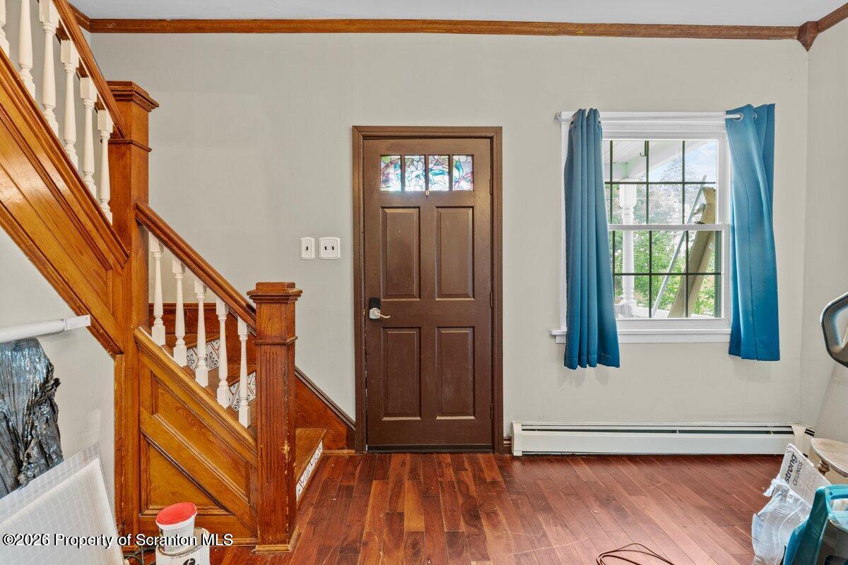 1411 Watson Street Scranton, PA 18504 - Photo 6 of 26 a view of an entryway with wooden floor and door