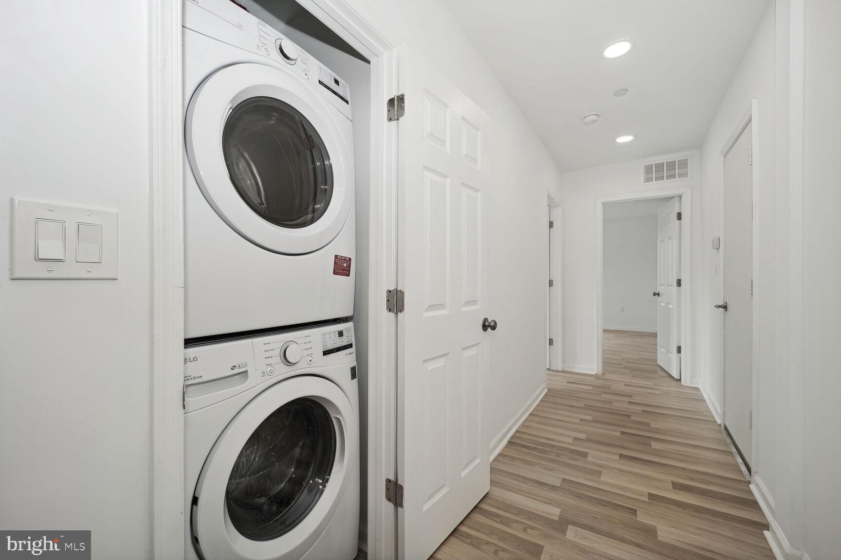 1642 16th Street Southeast, Unit 3 Washington, DC 20020 - Photo 20 of 22 a view of a hallway with washer and dryer
