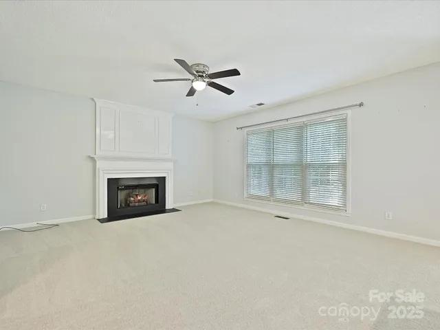 a kitchen with a sink refrigerator and microwave