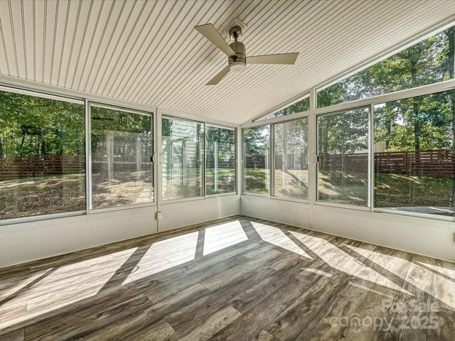 a white refrigerator freezer and a stove sitting inside of a kitchen