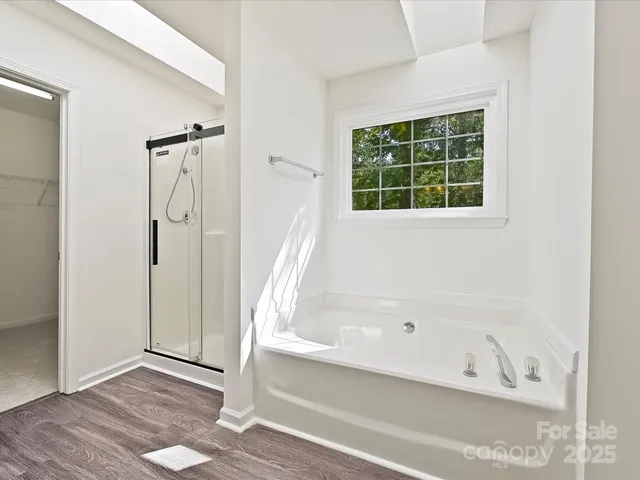 a bathroom with a double vanity sink and mirror