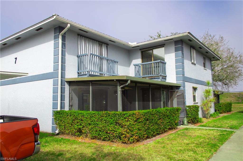 707 Hoover Dike Road Clewiston, FL 33440 - Photo 1 of 39 a front view of a house with a yard