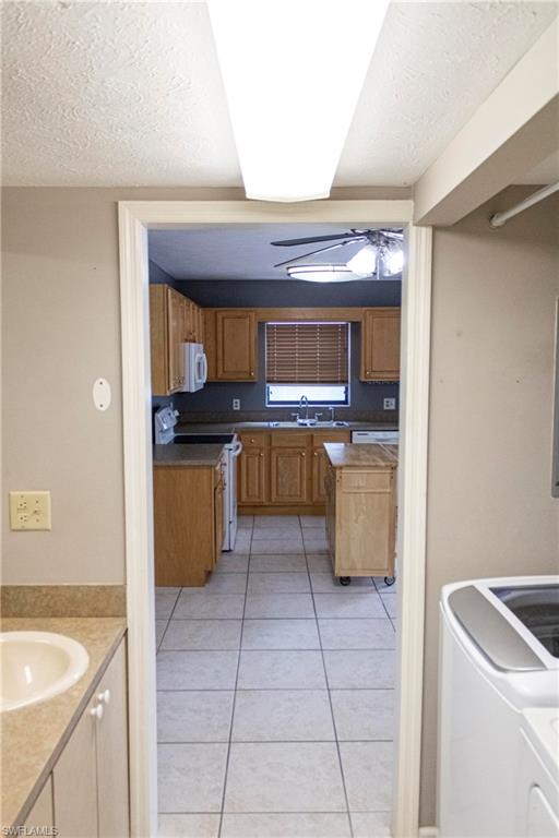 707 Hoover Dike Road Clewiston, FL 33440 - Photo 19 of 39 a kitchen with a sink a stove and cabinets