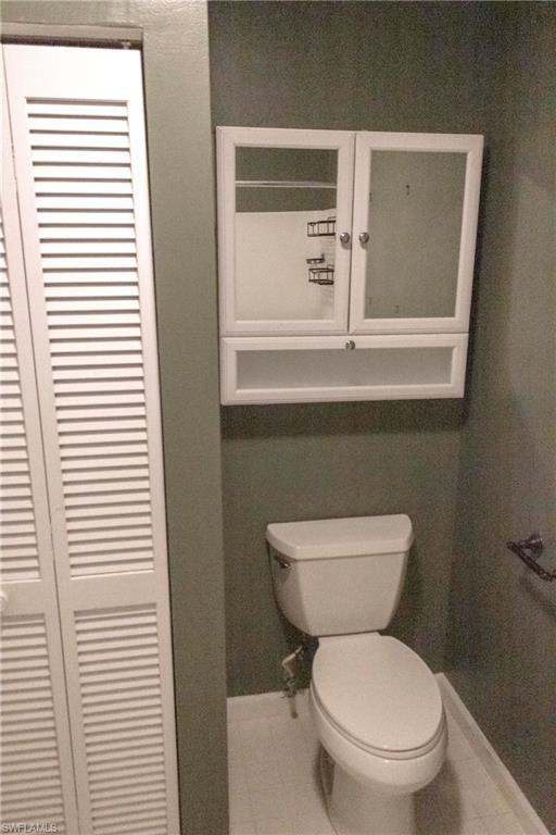 707 Hoover Dike Road Clewiston, FL 33440 - Photo 34 of 39 a white toilet sitting next to a window