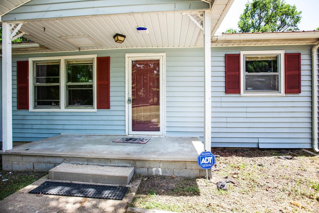 This home has lots of character!  A great yard, covered front porch, double carport.