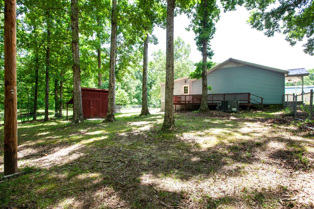 2422 Grays Bend Road Centerville, TN 37033 - Photo 20 of 30 A side view shows the great shady yard