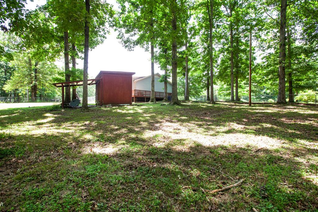2422 Grays Bend Road Centerville, TN 37033 - Photo 21 of 30 A view of the home and storage building from the back yard