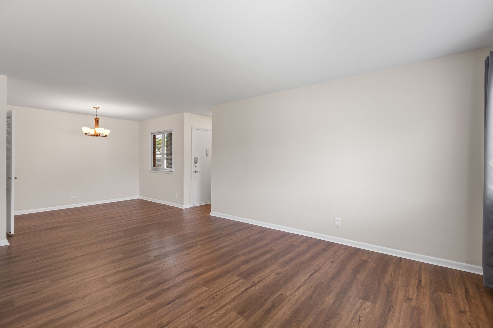 1900 Richard Jones Road, Unit R1 Nashville, TN 37215 - Photo 7 of 29 a view of an empty room with wooden floor