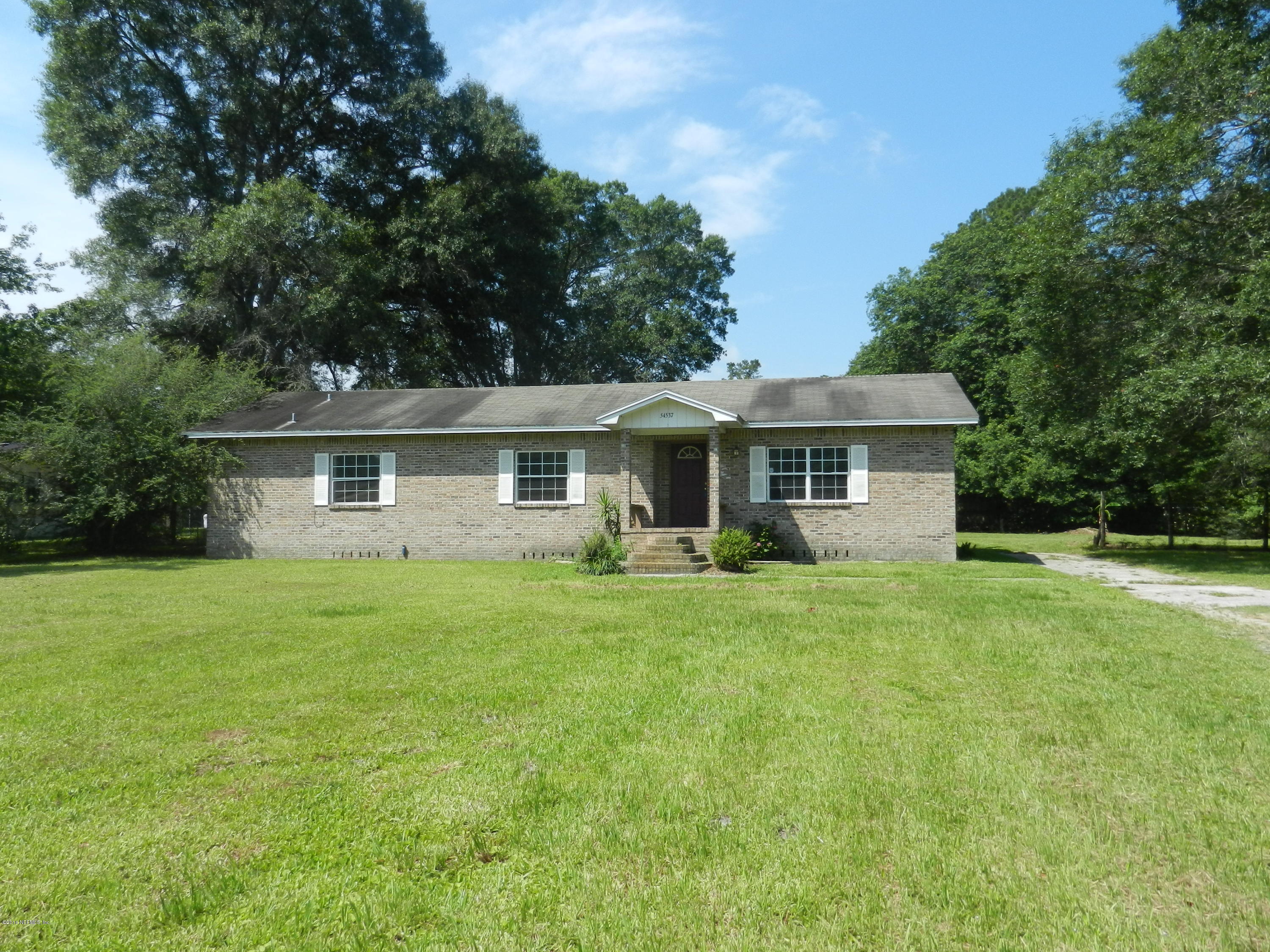 54537 Marlee Road Callahan, FL 32011 - Photo 1 of 17 a front view of house with yard and green space