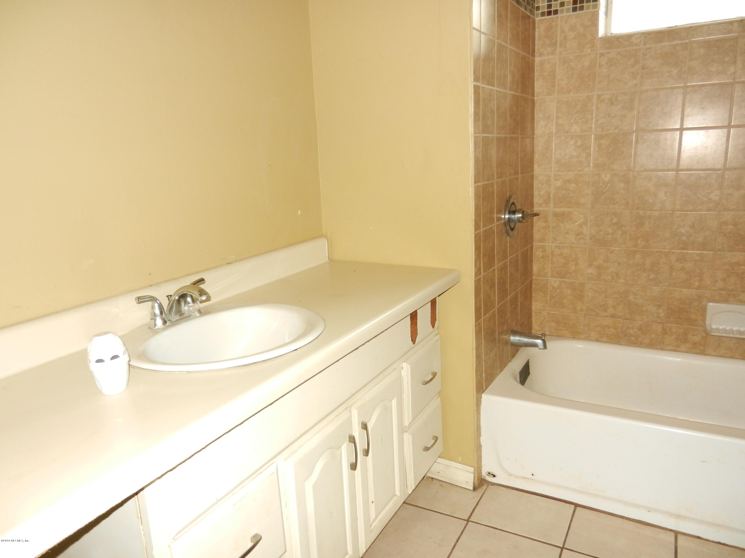 54537 Marlee Road Callahan, FL 32011 - Photo 11 of 17 a bathroom with a sink and a bathtub