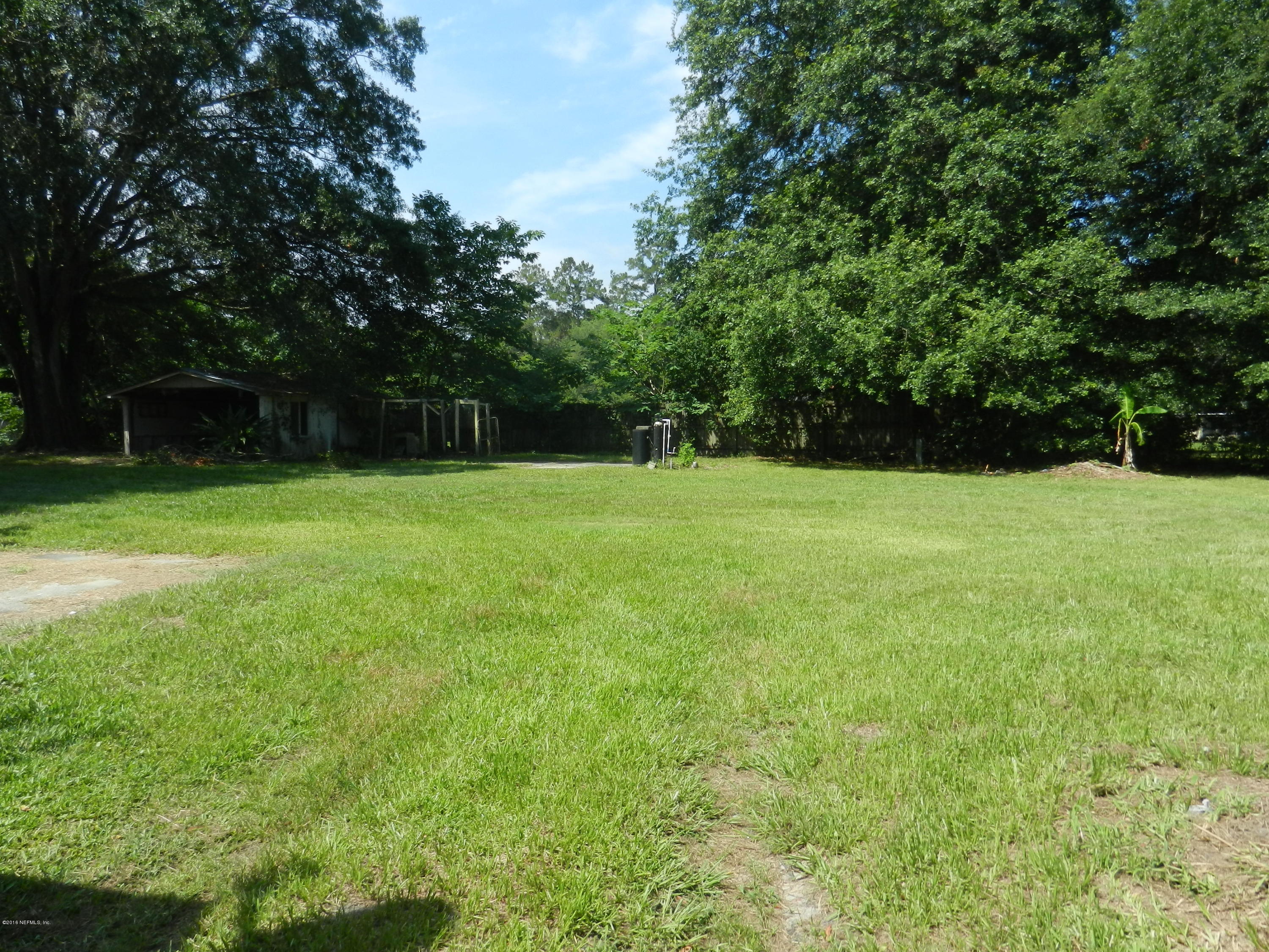 54537 Marlee Road Callahan, FL 32011 - Photo 16 of 17 a view of field with trees in the background