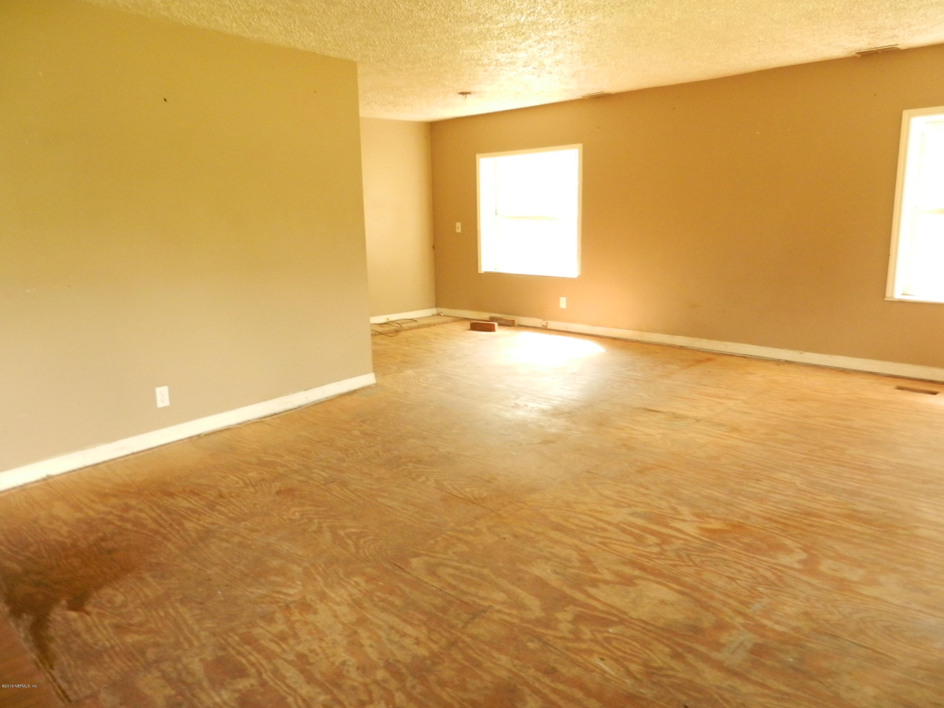 54537 Marlee Road Callahan, FL 32011 - Photo 2 of 17 an empty room with a empty space and a window