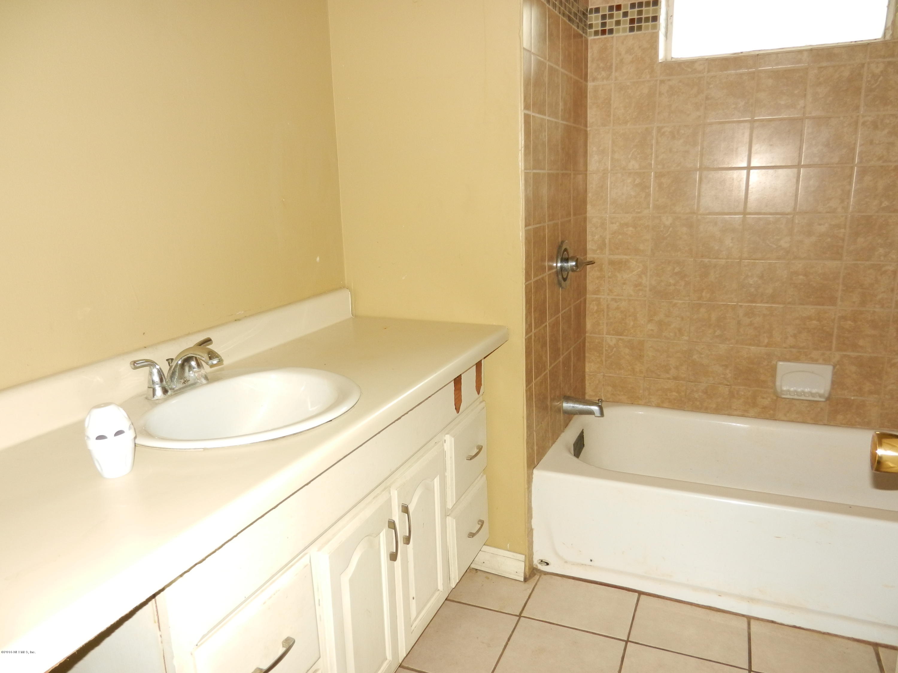 54537 Marlee Road Callahan, FL 32011 - Photo 4 of 17 a bathroom with a sink and a mirror