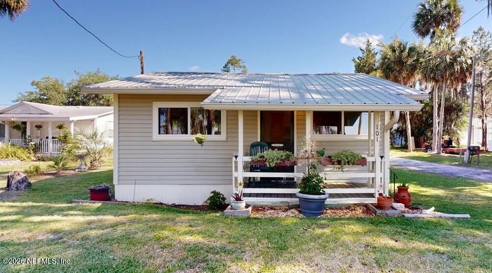 101 Possum Hollow Road Georgetown, FL 32139 - Photo 2 of 17 a view of a house with garden and plants