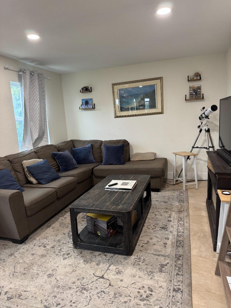2712 Ferguson Road Gilroy, CA 95020 - Photo 26 of 60 a living room with furniture and a wooden floor