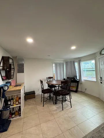 a bathroom with a sink a toilet and a shower curtain