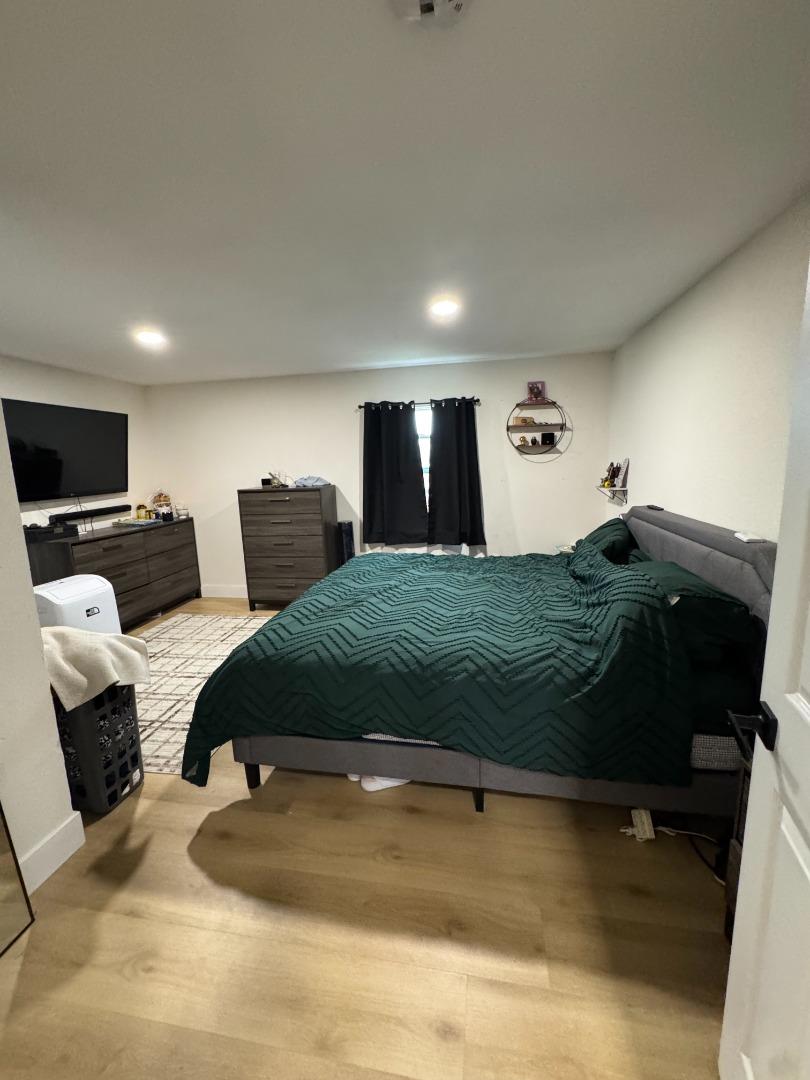 2712 Ferguson Road Gilroy, CA 95020 - Photo 31 of 60 a bedroom with a bed window and couch