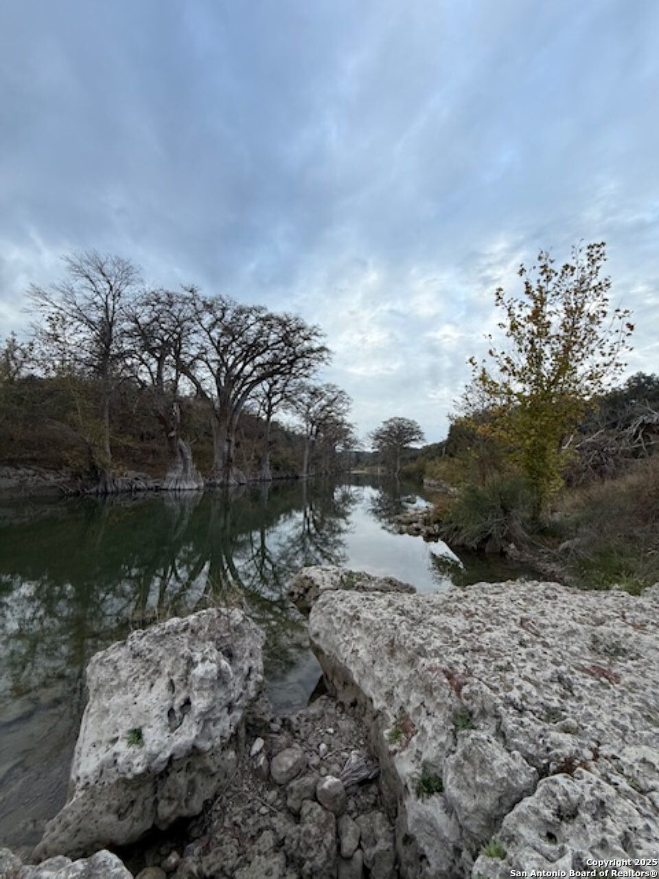 160 Restless Wind Spring Branch, TX 78070 - Photo 12 of 17 a view of a lake with mountains in background