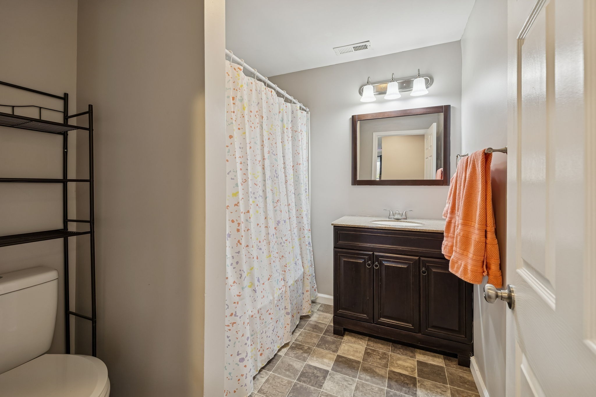 411 Purtle Road Lafayette, TN 37083 - Photo 19 of 40 a bathroom with a sink a toilet and shower