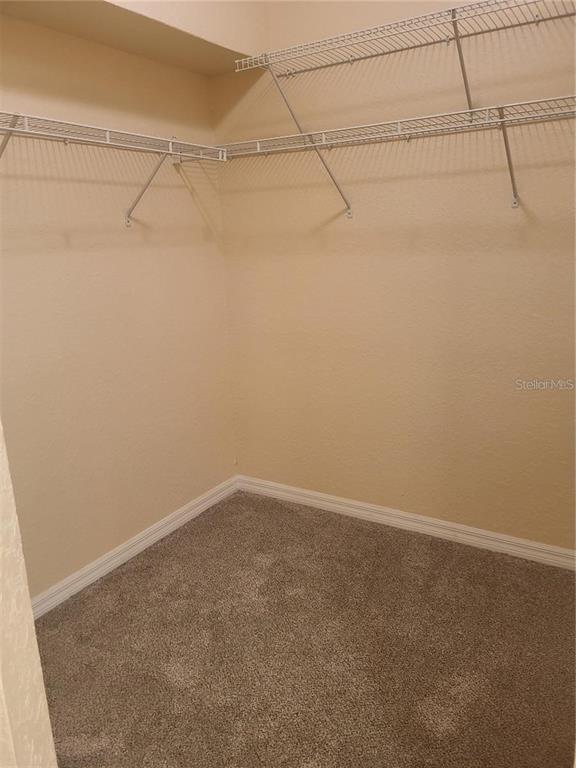 6405 Bay Cedar Lane, Unit 26 Bradenton, FL 34203 - Photo 13 of 19 a view of a room with racks on the wall