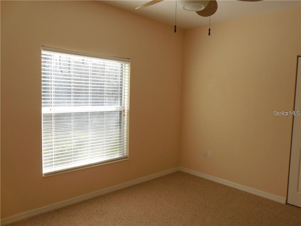 6405 Bay Cedar Lane, Unit 26 Bradenton, FL 34203 - Photo 14 of 19 a view of an empty room with a window