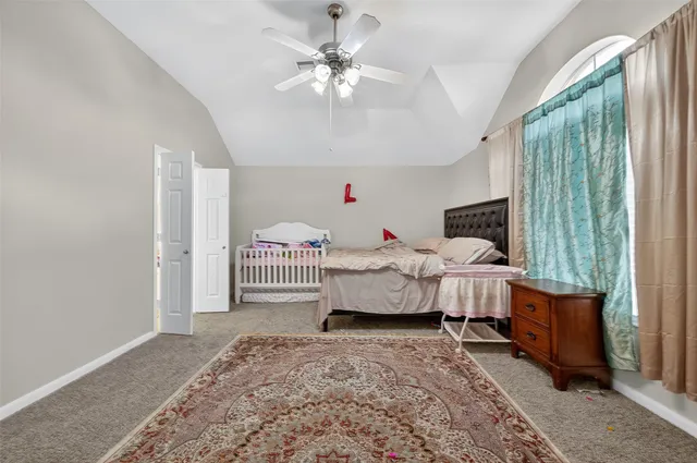 a bedroom with furniture and white walls