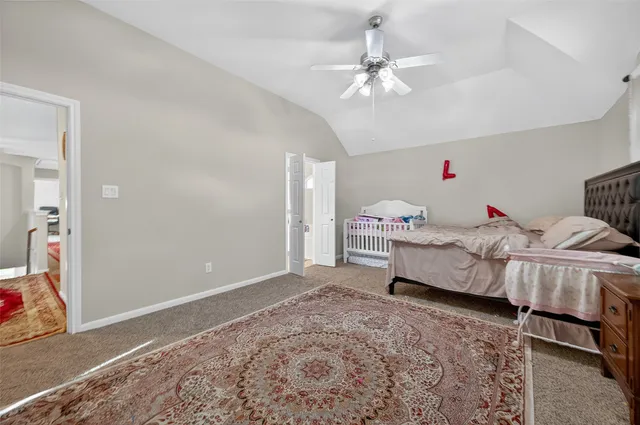 a spacious bathroom with a tub sink and mirror