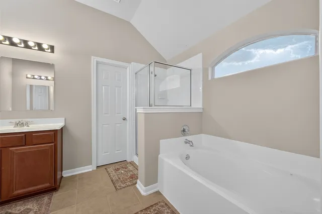 a bathroom with a sink vanity and a mirror