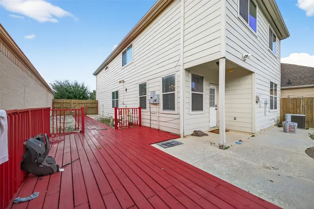 a view of a house with wooden deck