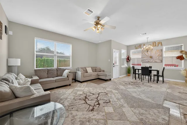 a living room with furniture and a window