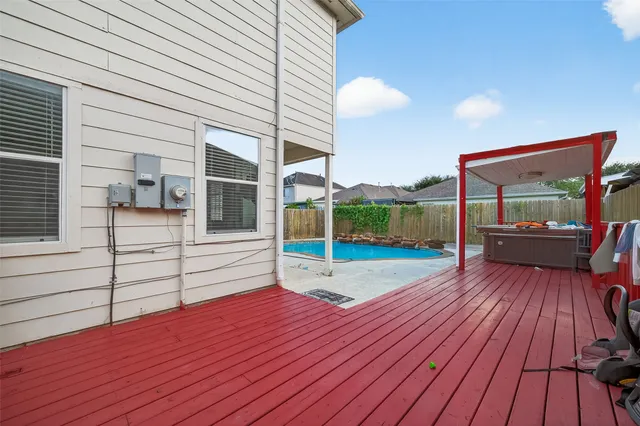 a view of a backyard with sitting area