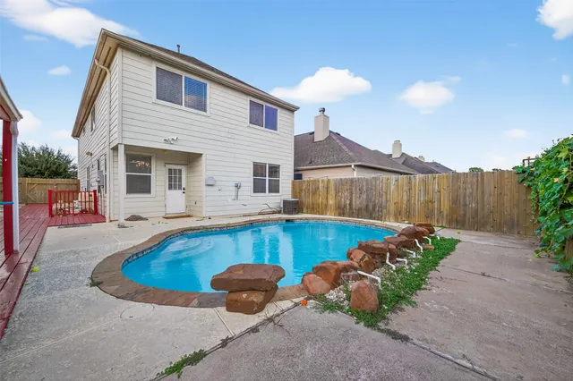 a view of a house with swimming pool