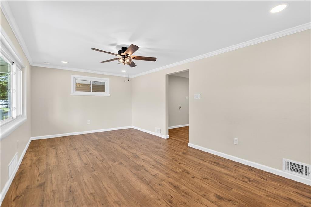201 Glen Eden Road Rochester, PA 15074 - Photo 8 of 34 an empty room with wooden floor and windows