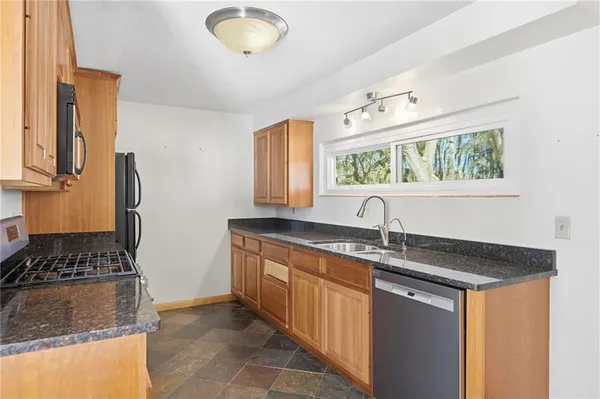 a kitchen with a sink and a stove