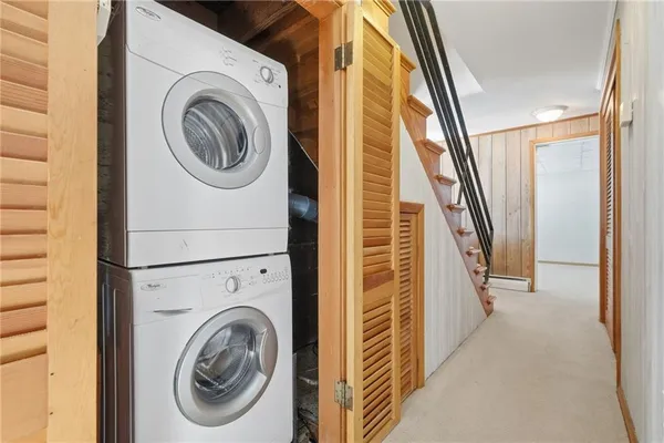 a view of a hallway with washer and dryer