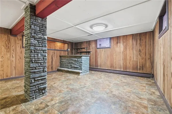 a view of an empty room with stairs